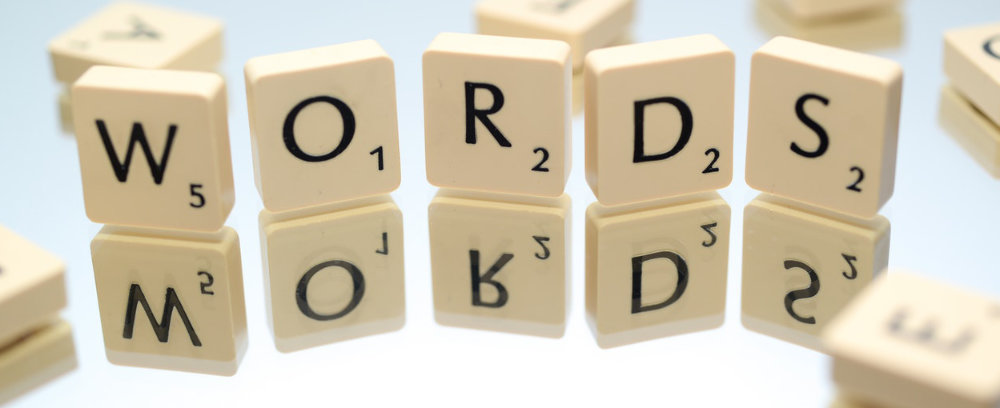 Scrabble pieces that spell "words"
